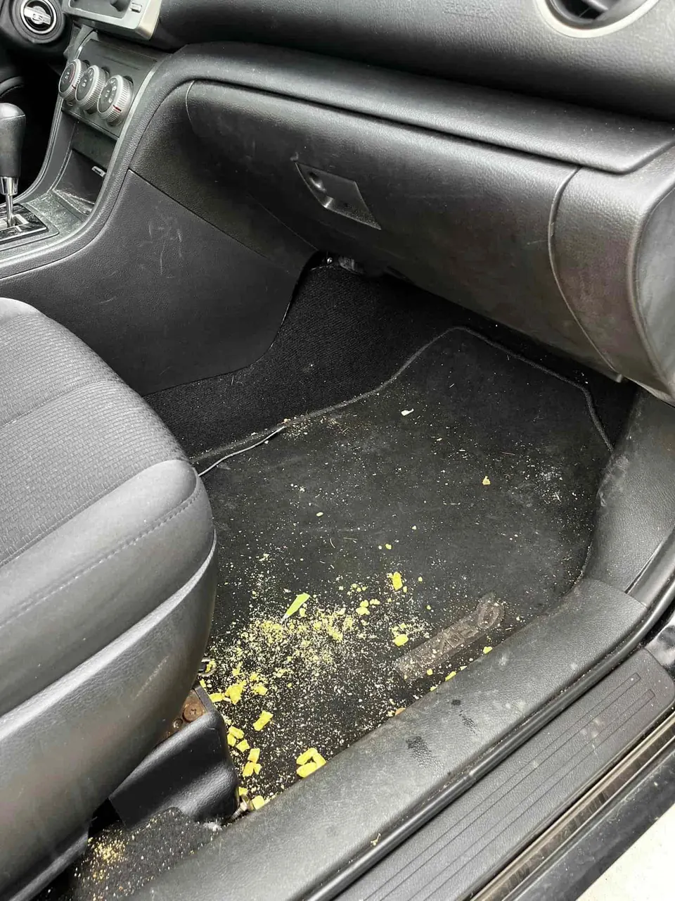 Before: driver footwell covered in crumbs and dirt